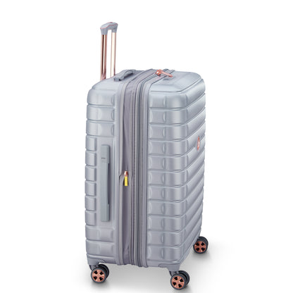Mala média expansível cinza com rodinhas giratórias e puxador retrátil, design moderno e resistente da marca francesa DELSEY, ideal para viagens.