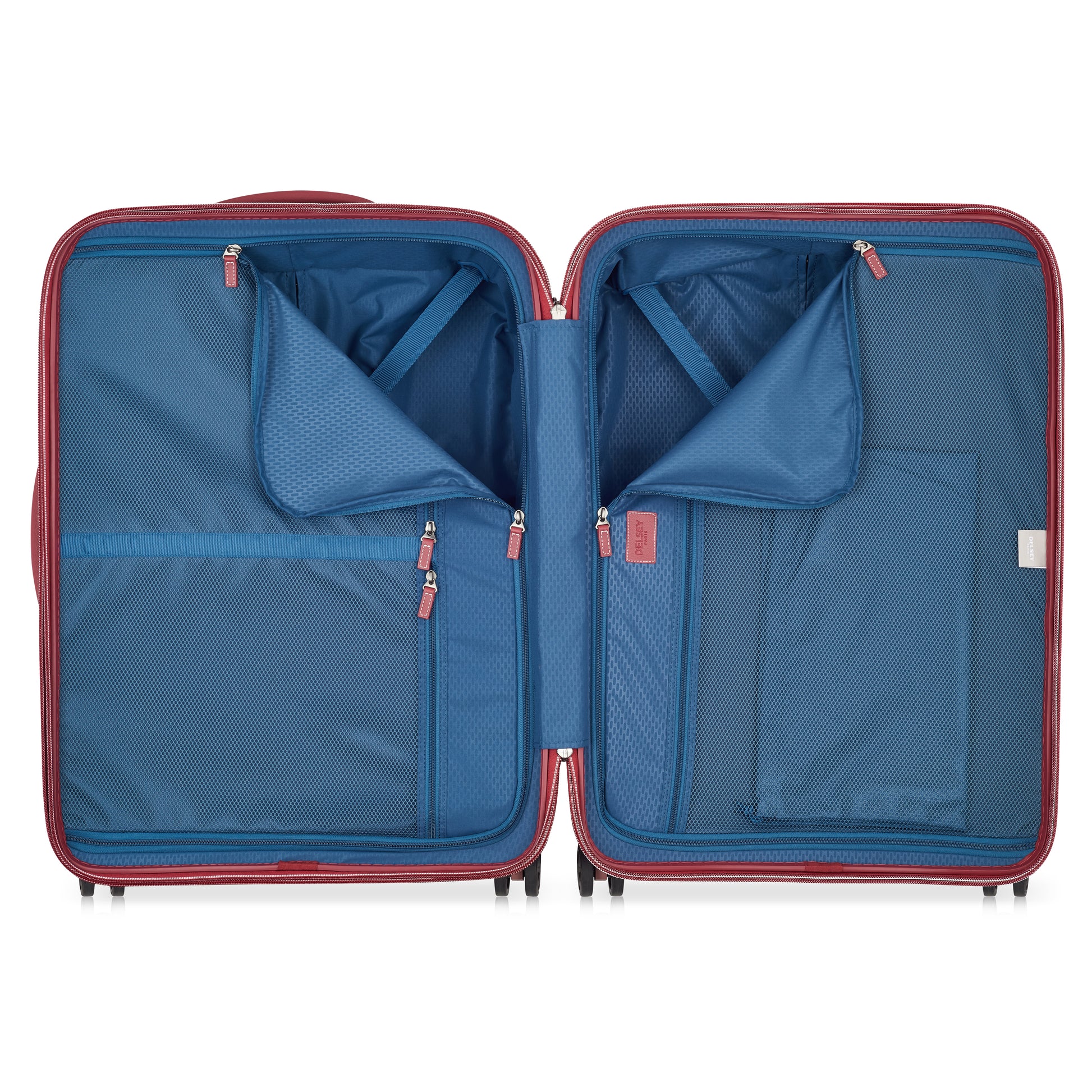 Interior da mala média DELSEY com várias divisórias de tecido azul, bolsos com zíper e cintas para organização eficiente de itens durante viagens.