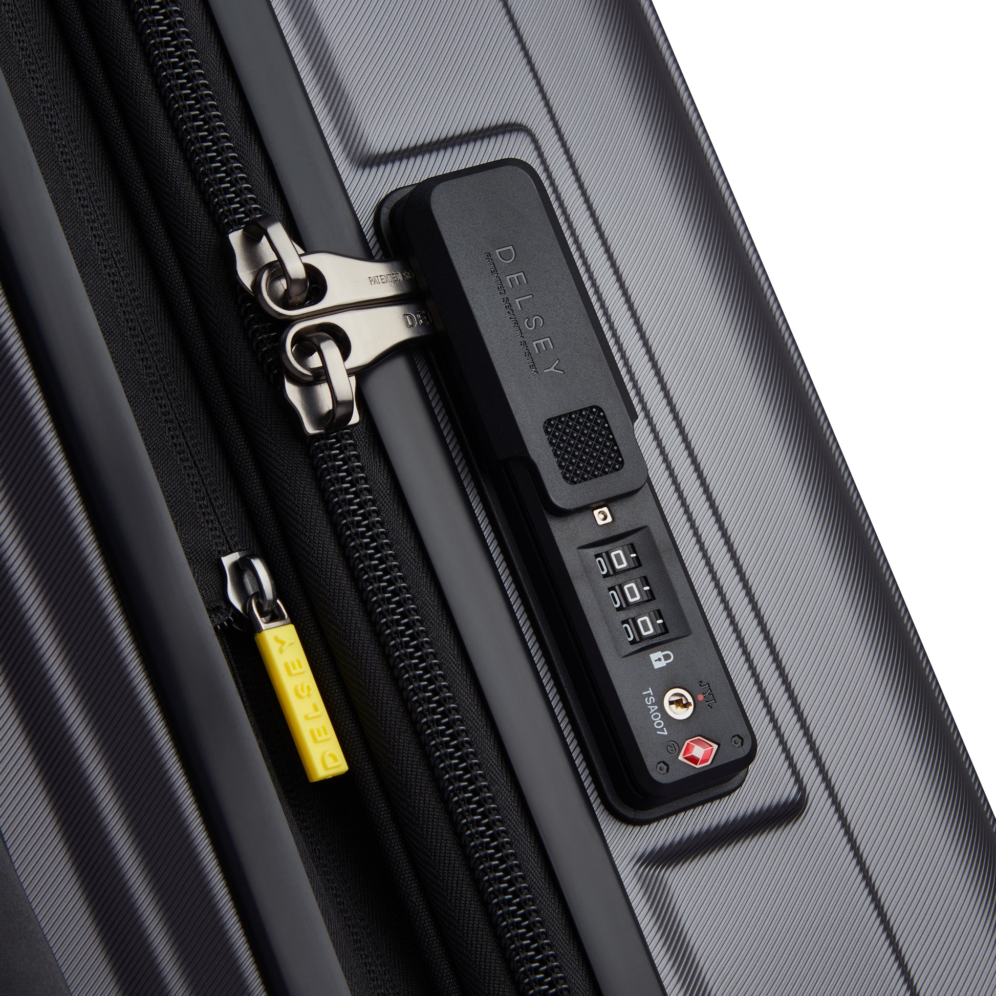 Fechadura com combinação TSA integrada em mala rígida expansível cinza escuro, fabricação DELSEY, que oferece segurança e durabilidade para viagens.