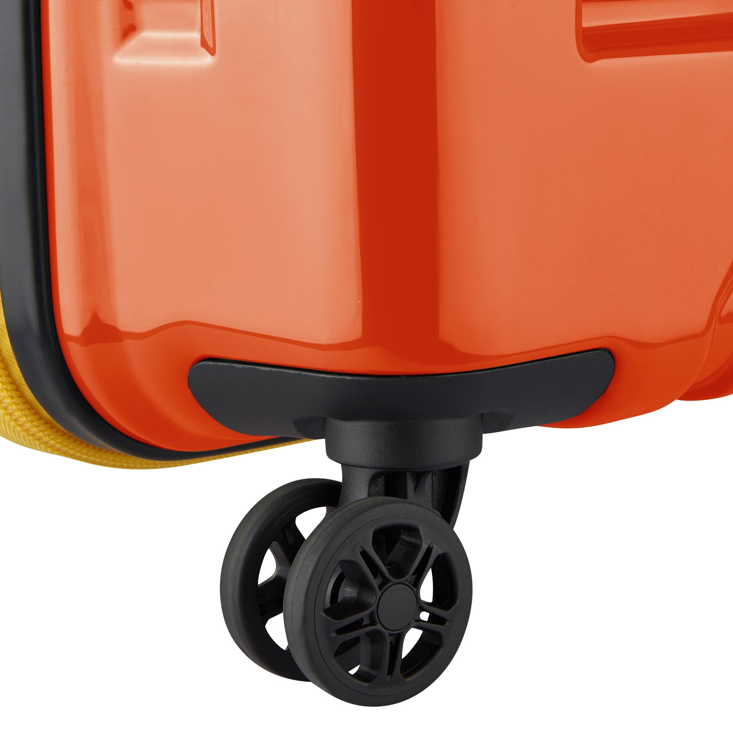 Roda dupla giratória preta em mala rígida laranja expansível, da DELSEY, ideal para facilitar mobilidade em viagens com design resistente e durável.
