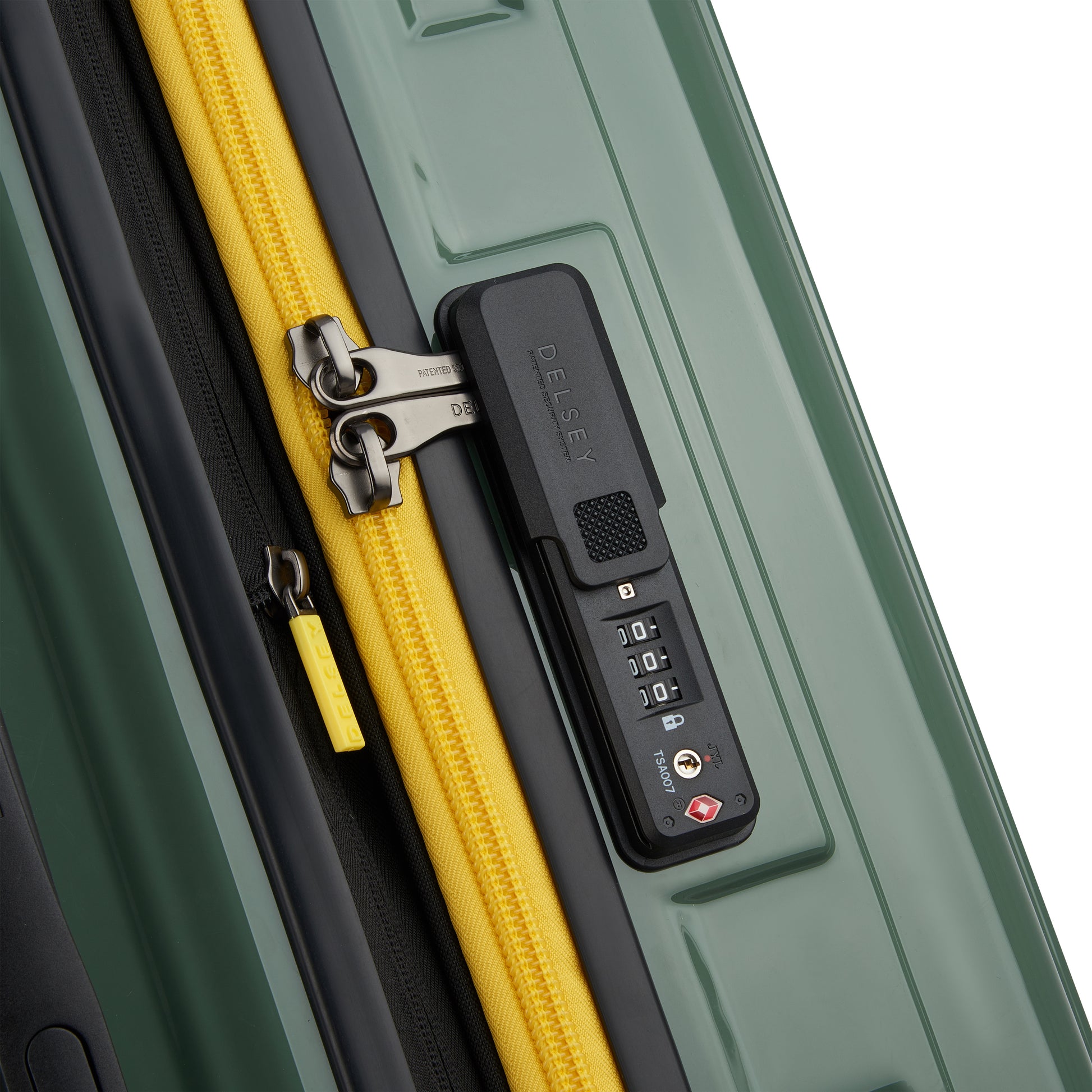 Fechadura TSA embutida com zíper antifurto em mala rígida verde modelo trunk grande expansível da DELSEY, ideal para viagens seguras e duráveis.