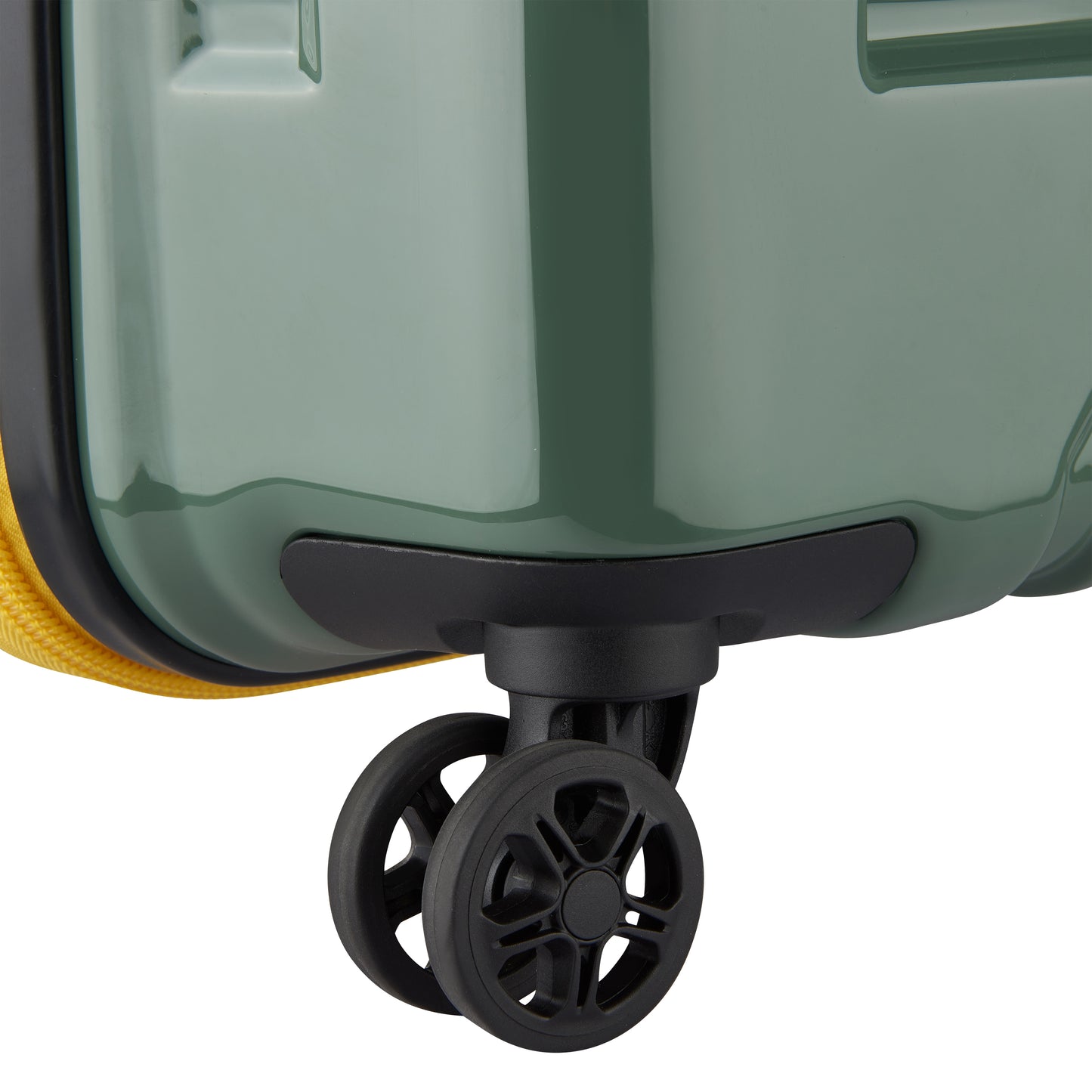 Roda dupla preta resistente em mala grande rígida expansível na cor verde, modelo DELSEY com acabamento brilhante e design robusto para melhor mobilidade.