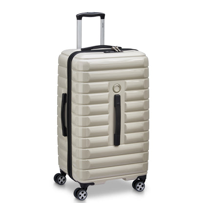 Mala de viagem rígida off white da DELSEY com formato trunk, rodas giratórias, alça telescópica e zíper resistente para maior durabilidade e segurança.