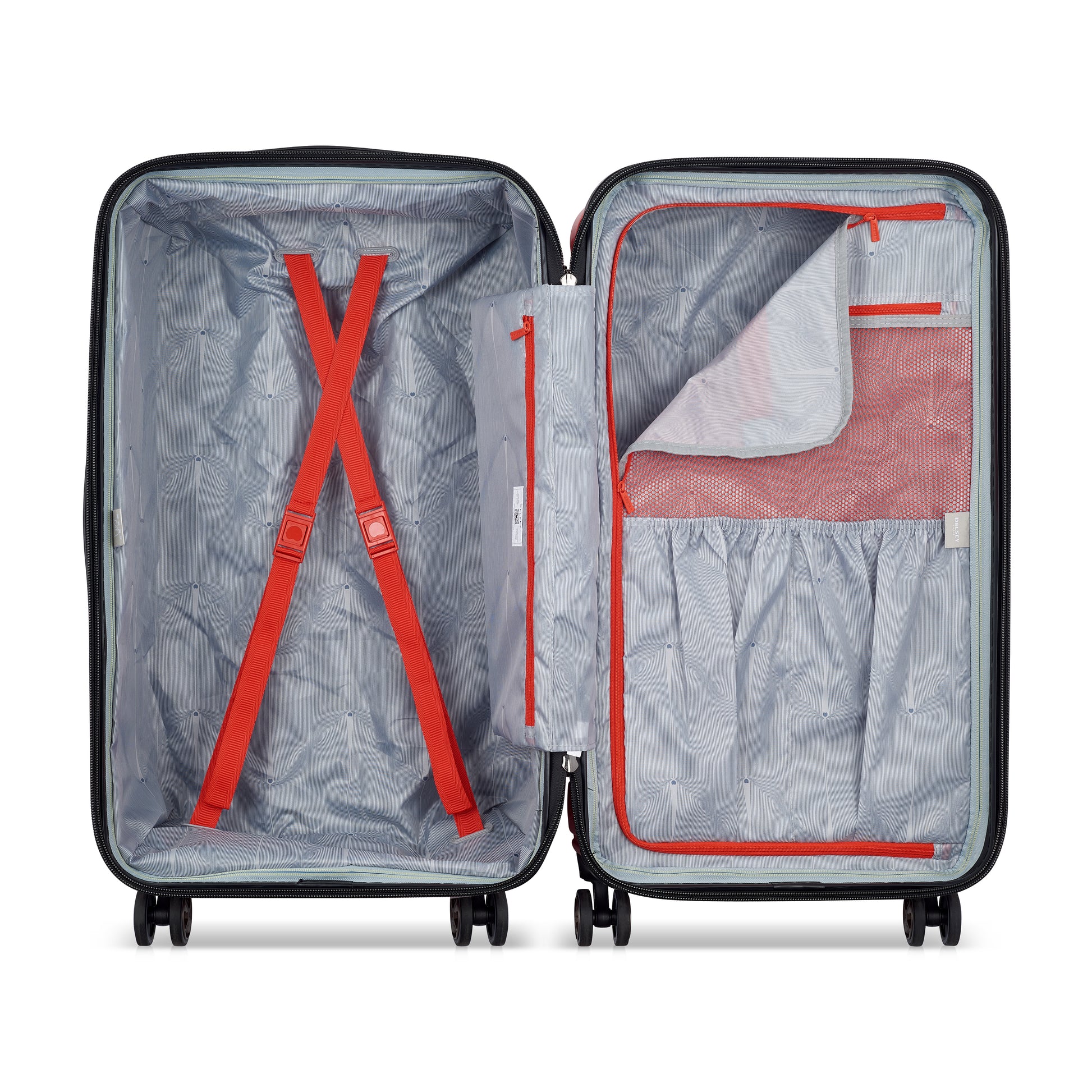 Interior de mala média rígida da DELSEY com compartimentos organizadores, zíperes vermelhos e cintas para fixação de roupas, ideal para viagem.